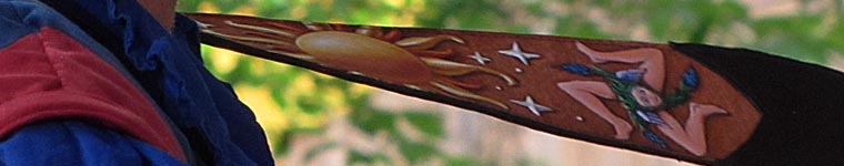 gituar strap witj painted images of the sun and stars.. 